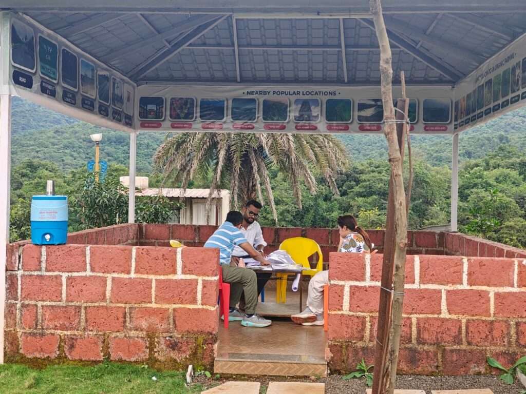 Visitors exploring Mayurvan Valley project with stunning Bhatghar Dam backdrop and natural scenery
